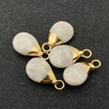 Detail view of teardrop natural stone charms with polished gold-plated metal bails - Cream White (No.13)