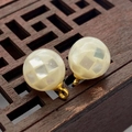Macro shot of mosaic shell bead charms with white checkerboard texture and gold loop - 8mm / White Shell