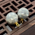 Macro detail of spherical shell mosaic pendant with golden loop for jewelry DIY - 8mm / Grey Shell