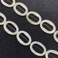 Macro detail of natural mother of pearl shell oval beads with iridescent luster finish - Oval Style (6)