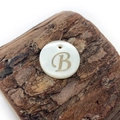 Natural freshwater shell round pendant with golden letter B and polished finish - Letter B