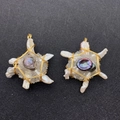 Detailed macro view of handmade star-shaped baroque pearl and crystal wire-wrapped pendant - US 1