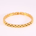 Detail of a 6mm gold presidential link stainless steel bracelet on a soft violet surface - Standard Three-Link Style / Gold