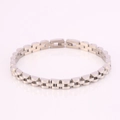 Detail view of silver stainless steel three-bead link watch band bracelet with fold-over clasp - Standard Three-Link Style / Silver