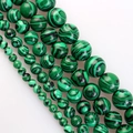 Strands of round green malachite beads in various sizes for DIY jewelry making - Malachite