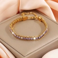 Elegant gold-tone chain bracelet featuring purple and clear crystals on a satin background - Gold With Light Purple And White Zircon