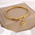 Golden titanium steel twisted cable bangle with sun pendant and shimmering crystals - Sun Flower Zircon