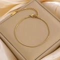 Elegant gold-plated stainless steel snake chain bracelet for women on silk background - Gold Round Snake Bracelet