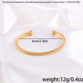 Detalle del brazalete trenzado bañado en oro de 18k con diámetro de 6cm y peso de 12g - Dorado Abierto (Trenza Gruesa)