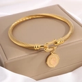 Golden cable bracelet featuring a U-shaped clasp and pink gemstone heart pendant charm - Round Disc Gem Horseshoe