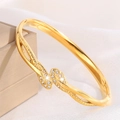 Eleganter vergoldeter Edelstahl-Armreif mit gekreuztem Kristall-Design für Damen - Gold