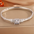 Macro shot of silver titanium steel bracelet featuring a large square-cut diamond inlay - Silver Large Square Diamond Bracelet