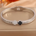 Detail of clover bangle with black and white shell inlay, Greek pattern and pavé crystals - Greek Key Single Clover / Silver