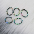 Five oval natural abalone shell pendants with colorful iridescent luster on white plush - 024 Oval 14x18mm