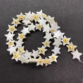 Detail of star-shaped shell beads with evil eye design for DIY jewelry making - Yellow