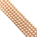 Detailed view of champagne pearl beads showing smooth glossy finish and round shape - Light Pink / 10mm