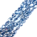 Detailed view of light blue irregular natural shell beads with metallic pearl coating - No.7 (Ice Blue)