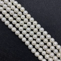 Macro detail of glossy white 8-10mm imitation pearl beads for DIY jewelry making - White / 10mm