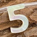 Macro view of natural mother-of-pearl number 5 bead for DIY jewelry making - Number 5 / 6x10mm, 1g