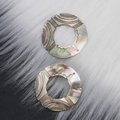 Black sea shell carved circular pendant with iridescent geometric textured patterns - Circular Shape