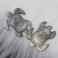 Pair of carved black sea shell turtle pendants with iridescent mother of pearl finish - Turtle Shape