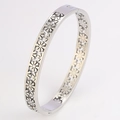 Silver daisy cut-out stainless steel bangle with flower pattern and hidden clasp - Silver