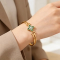 Detail of gold titanium steel open bangle with malachite clover and sparkling diamond accents - Green