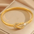Bracelet nœud en acier inoxydable plaqué or 18k serti de diamants brillants - Or