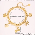 Detalles de pulsera de acero dorado con dijes de mariposa, serpiente y flores - Dorado (5762767900023)