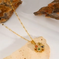 Close-up of four-leaf clover pendant with multi-colored gemstones and sparkling diamonds - Rotating Multicolor Zirconia Clover Necklace