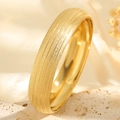 Wide gold titanium steel bangle with frosted finish and five polished grooves shown on stone - Frosted Horizontal Stripes (Circular Sand Gold Buddha Light Striped Bangle)