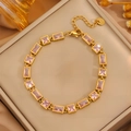 Bracelet luxe en acier inoxydable doré avec zircons roses dans un coffret en cuir - Bracelet Zirconium Rose Carré Or