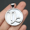 Detail shot of Capricorn natural white shell round pendant with silver plating - 32x37mm / Capricorn
