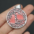 Detailed view of silver Tree of Life pendant with red background held in hand for scale - No.5 (Wine Red)