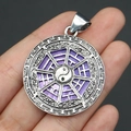 Macro detail of silver Bagua Tai Chi pendant with vibrant purple shell inlay in hand - 29x39mm / Pendant Type 3 (Seahorse)