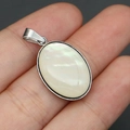 Macro view of oval abalone shell pendant in silver stainless steel frame - Pendant Only (Without Chain) / Pendant Only (Without Chain) - White Mother of Pearl