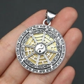Macro detail of round Tai Chi Bagua pendant showing shell texture and silver cloud carvings - 29x39mm / Pendant 4