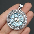 Close-up of silver Tai Chi Bagua pendant with blue shell inlay and detailed carvings - 29x39mm / Pendant 6