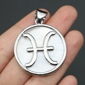 Silver Pisces zodiac pendant featuring white mother of pearl inlay and metal symbol - 32x37mm / Pisces