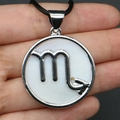 Round silver Scorpio zodiac necklace with white shell inlay and sleek black cord - Scorpio (With Necklace Cord)