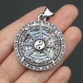 Silver Tai Chi Bagua pendant with colorful iridescent abalone shell inlay on black background - 29x39mm / Pendant 9