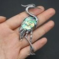 Detailed view of crane brooch with vintage silver metal and colorful abalone shell inlay - 43x79mm / Abalone Shell