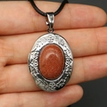 Goldstone locket pendant with floral copper engraving on a black woven cord - With Black Woven Cord / Goldstone Necklace