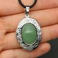Locket necklace with green oval stone and floral silver pattern on black cord - With Black Woven Cord / Green Aventurine Necklace