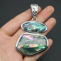 Close-up of a double-layered abalone shell pendant with carved silver alloy bail - Multicolor Abalone Shell Style (No. 1)