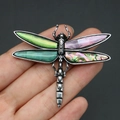 Detailed close-up of a dragonfly brooch with colorful abalone shells and vintage alloy finish - Emerald Green (No. 2)