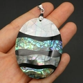 Detailed close-up of a large oval mosaic pendant made from natural sea shell and abalone - Oval Style B (40x52mm)