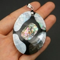 Macro detail of oval abalone and mother of pearl mosaic pendant with silver metal bail - Oval Style A (41x53mm)