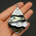Detailed view of teardrop abalone shell pendant held in hand for size visualization - Teardrop Style (42x55mm)