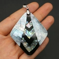 Detailed view of a diamond-shaped natural shell pendant with abalone shell mosaic inlay - Rhombus Style (48x58mm)